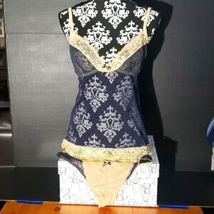 Blush. NWOT. 2-piece lace strappy cami top and thong. Navy & Gold. Size LG.